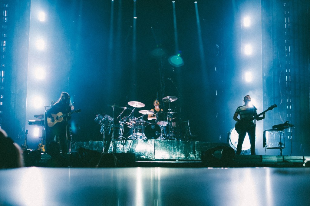 Wayne Sermon, left, Daniel Platzman, center, and Ben McKee, right, of Imagine Dragons perform at Bridgestone Arena in Nashville, Tenn. on Wednesday, June 8, 2015, The performance was part of the band's "Smoke + Mirrors" tour. (MTSU Sidelines / Andre Rowlett)