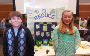 Fifth-graders Jackson McCrae and Hope McDonald stand at MTSU's 23rd annual Invention Convention in the Student Union Ballroom February 26, 2015, with a game they invented to teach good recycling habits. Photo by Christa Adams