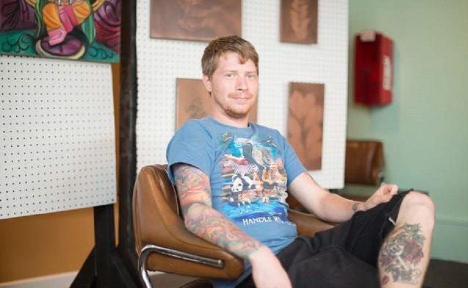 Two-Tone Art Gallery owner Todd Wilson sits in the gallery's space at 113 West Lytle Street in Murfreesboro Tenn. Wilson opened teh gallery to showcase local artists' works. (Matt Masters/MTSU Sidelines)