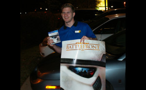 Murfreesboro resident Griffin Rollins poses with his Battlefront game and poster. (MTSU Sidelines/ Tanner Dedmon)