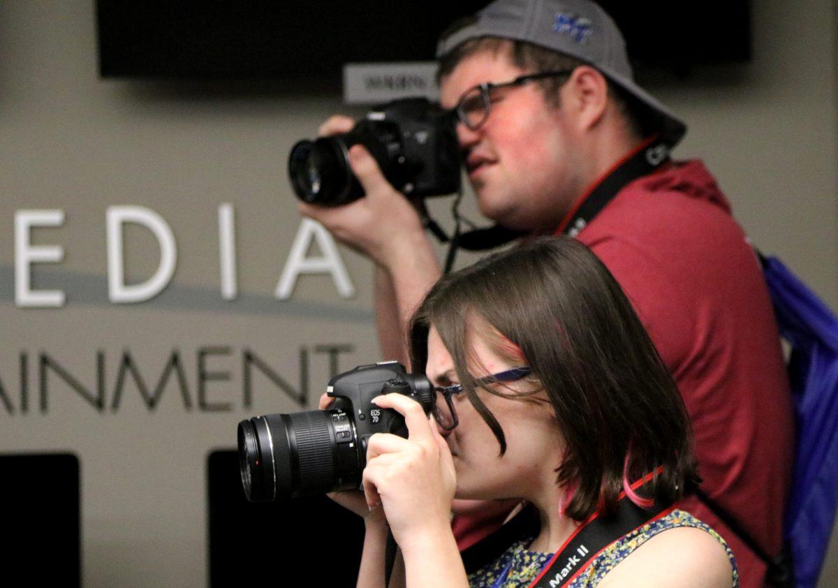 Cody and Allison shoot photos in the Center for Innovation in Media during a photo bingo game Tuesday, July 12, 2016.