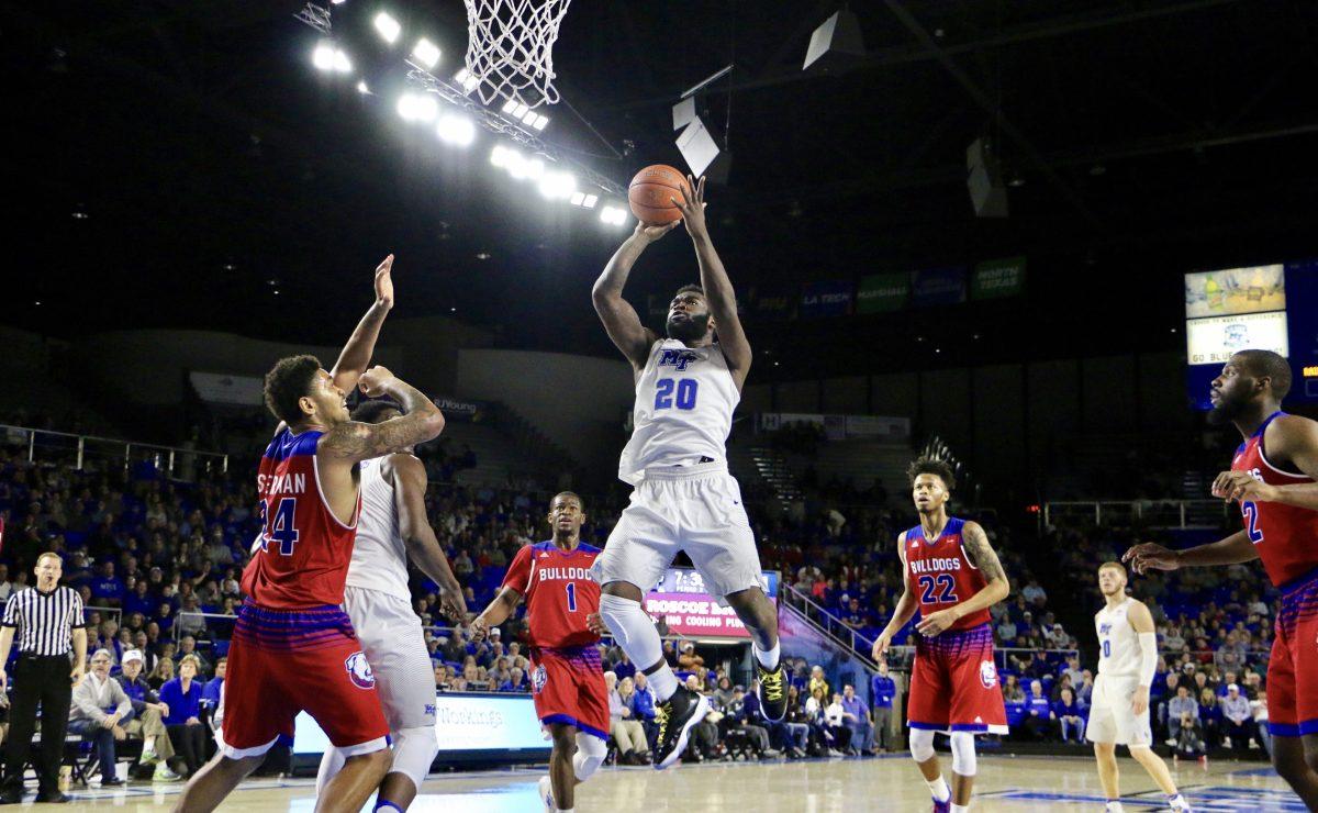 Giddy Potts hangs in the air for a jump shot during a game against Louisiana Tech on Jan. 29, 2017. (Photo by Tyler Lamb/Sports Editor) 