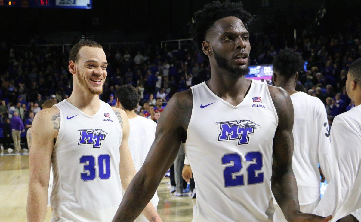 Seniors Reggie Upshaw and JaCorey Williams heading to shake hands after an emotional 71-61 win over La Tech. (Photo by Tyler Lamb/Sports Editor)