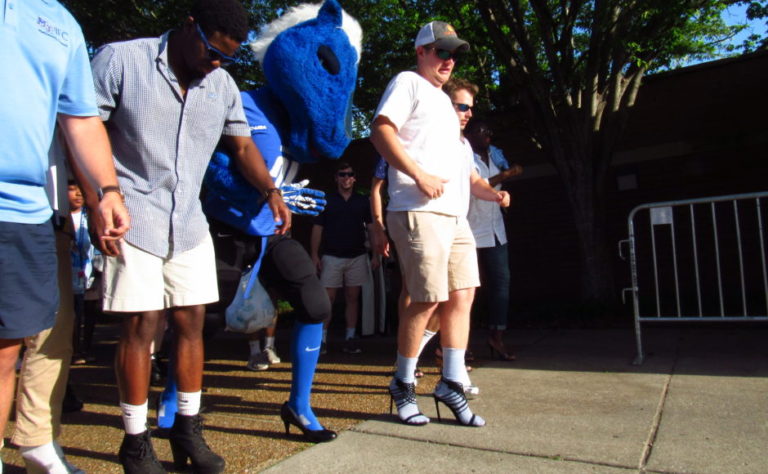 Fraternity men wear high heels to Walk a Mile in Her Shoes