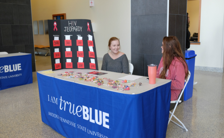 Students set up informational tables to promote free, anonymous HIV testing that will occur on campus