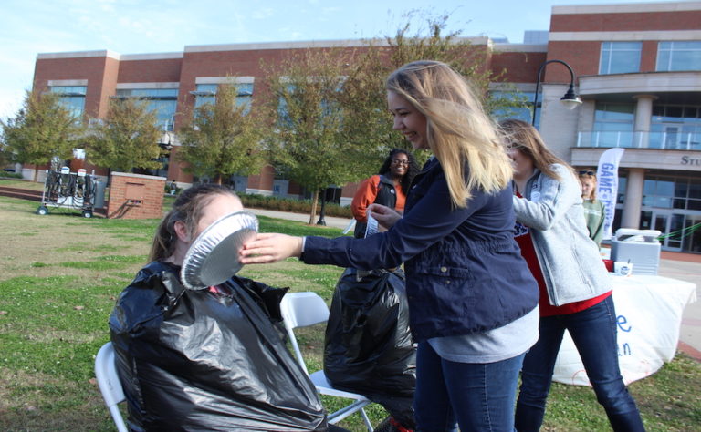 Video: ‘Pie an Alpha Chi’ raises money for local domestic violence shelter