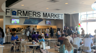 Students eat in the new dining hall Farmers Market.