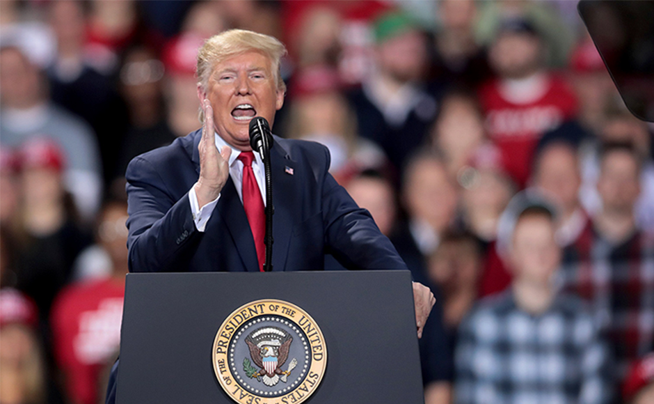 Trump speaks to a rally in Michigan before he gets news of his impeachment