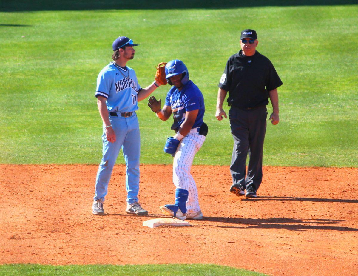 Shortstop Fausto Lopez waves to his teammates in the dugout after a double. (Will Carter / Sports Editor)