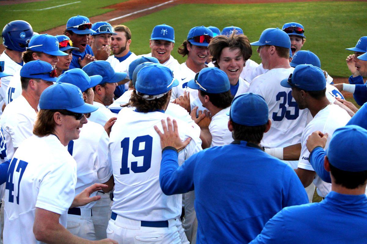 The Blue Raiders mob Jackson Galloway at home plate after his two-run homer. (Will Carter / Sports Editor) 