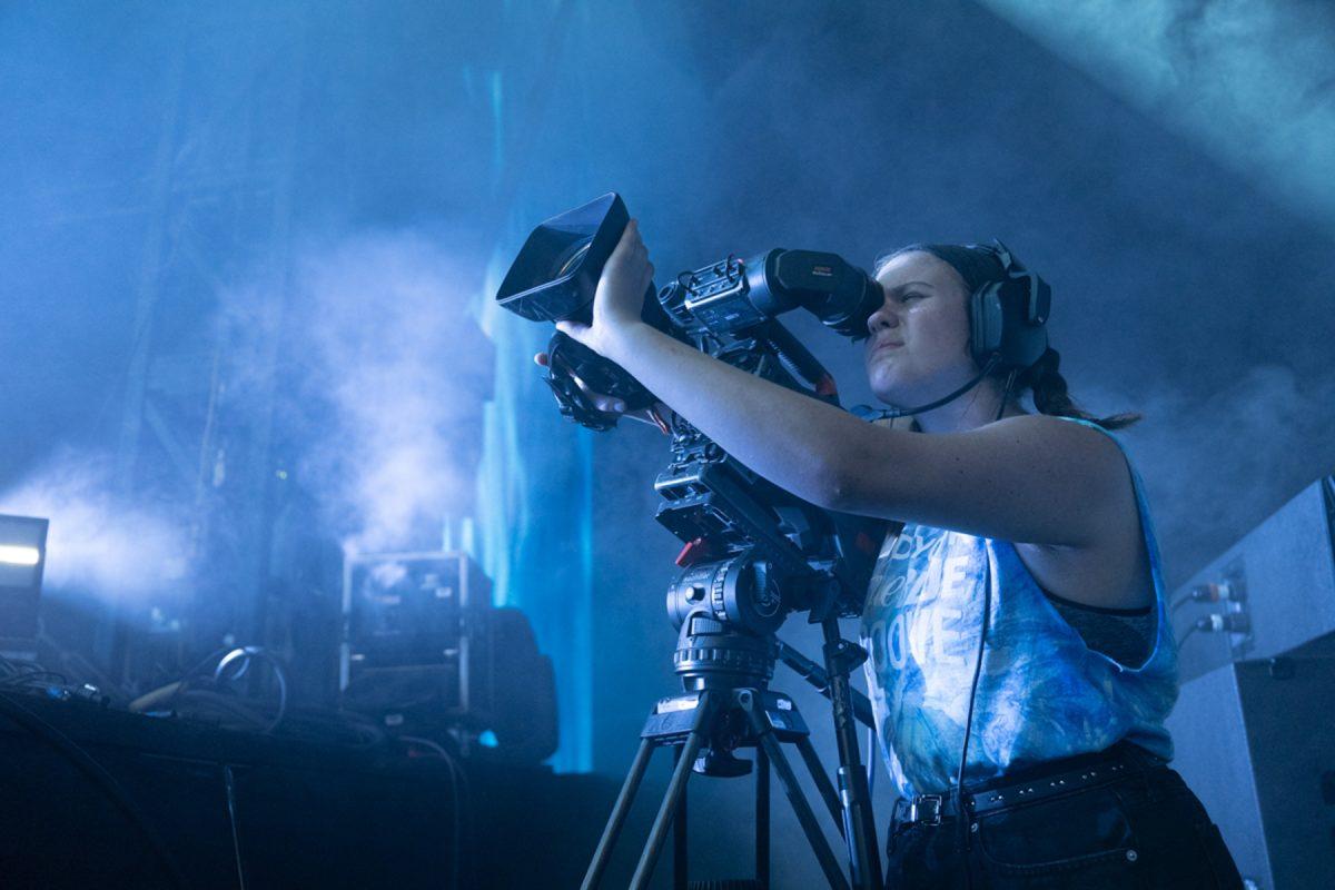 An MTSU College of Media and Entertainment student films a performance early Sunday, June 19, at the Bonnaroo Music and Arts Festival in Manchester, Tenn., one of 21 performances captured by students in the Media Arts and Recording Industry departments during the four-day festival. (MTSU photo by James Cessna)