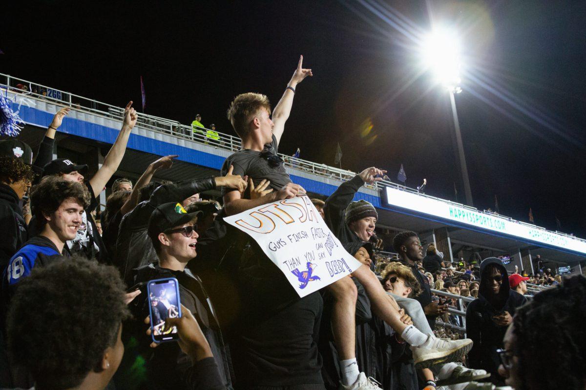 MTSU students cheer on the Blue Raiders in their blackout t-shirts. 