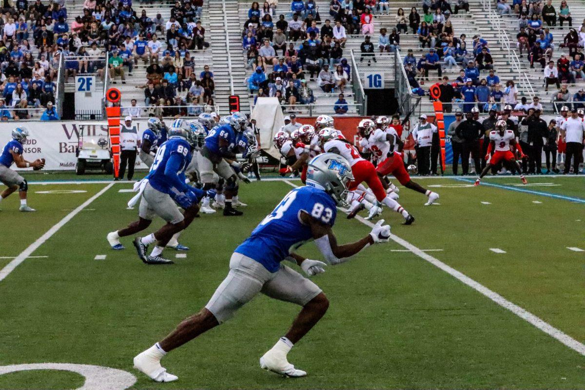 MTSU runs a play against WKU. Photo by Lucas Larkin. 