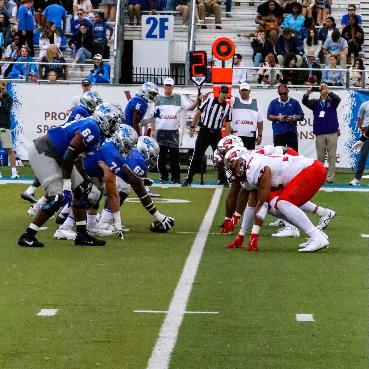 MTSU and WKU line up at the line of scrimmage, 10-15-2022. (Photo by Lucas Larkin) 