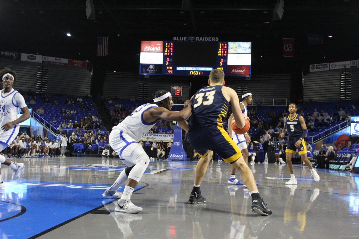 MTSU's Deandre Dishman guards Chattanooga's Jake Stephens in the post. Photo by Calvin White. 