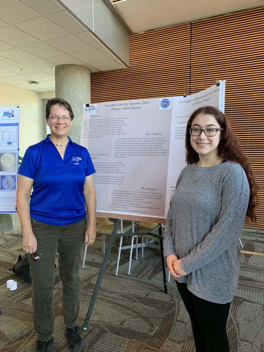 MTSU senior Charlotte Daigle, right, is shown with MTSU English professor Dr. Rhonda McDaniel at the Undergraduate Research and Creative Activity Open House at MTSU in November 2022. Daigle, as part of an Undergraduate Research Experience and Creative Activity grant.