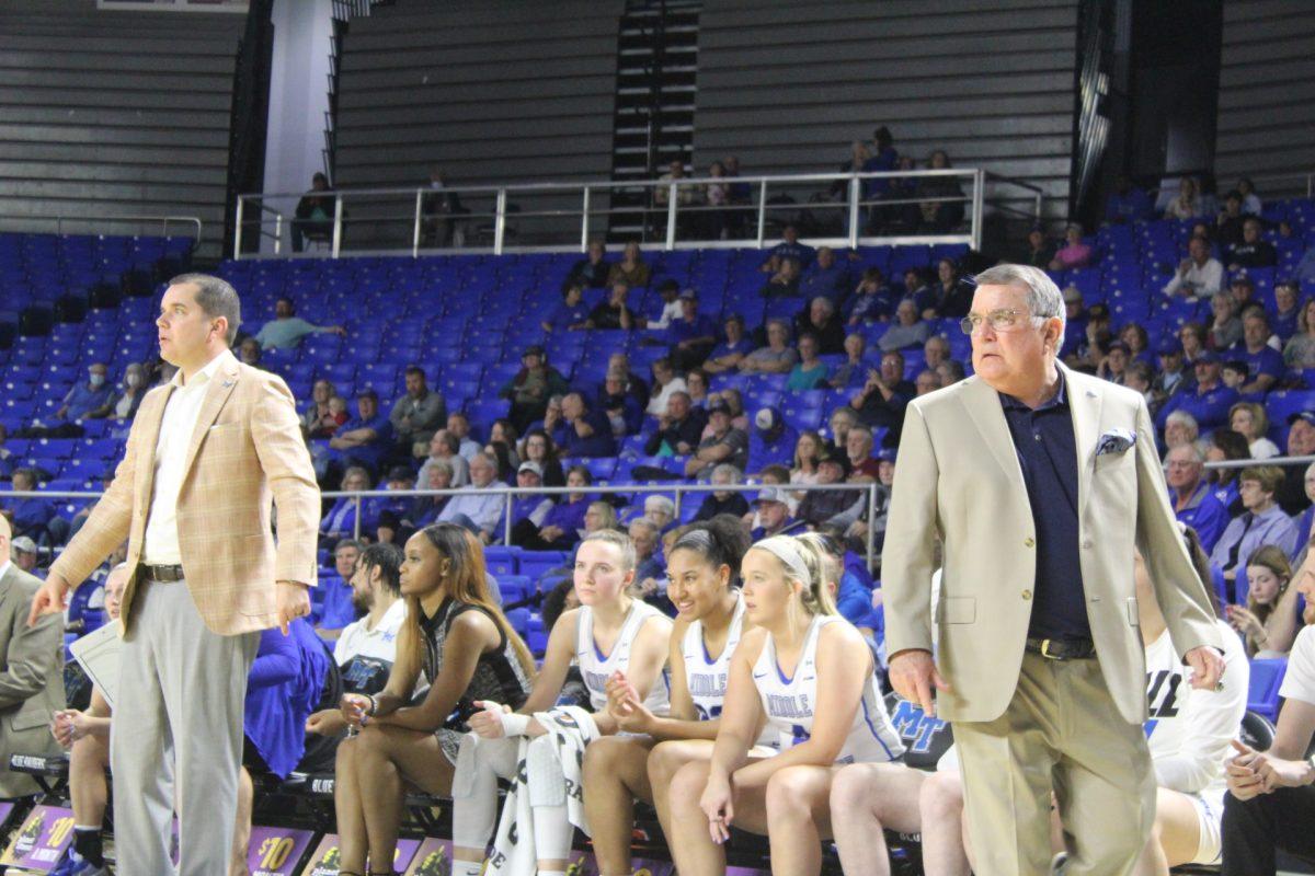 MTSU women's basketball head coach Rick Insell and associate head coach Matt Insell coach their team from the bench. (Photo by Calvin White)