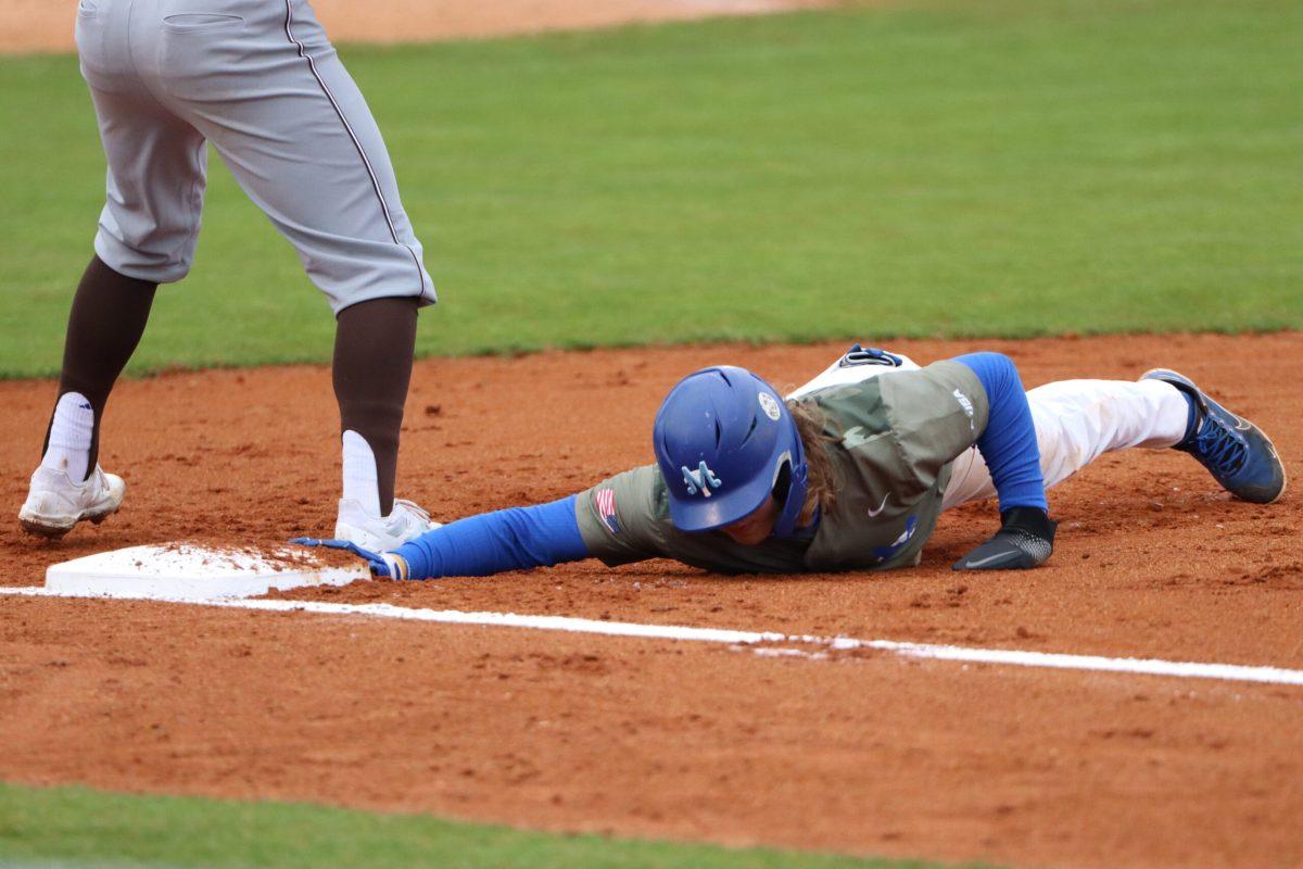 MTSU shortstop Brett Coker slides safely into third base. (Photo by Luke Larkin)