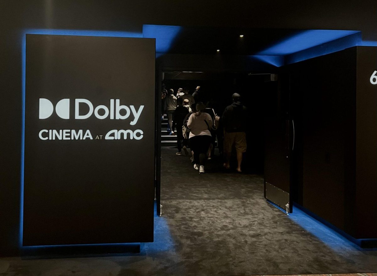 The all-new Dolby Cinema at AMC Stones River 9 can be seen with a sleek, modern black and blue color scheme from the outside of the auditorium. (Photo by Makayla Sulcer).