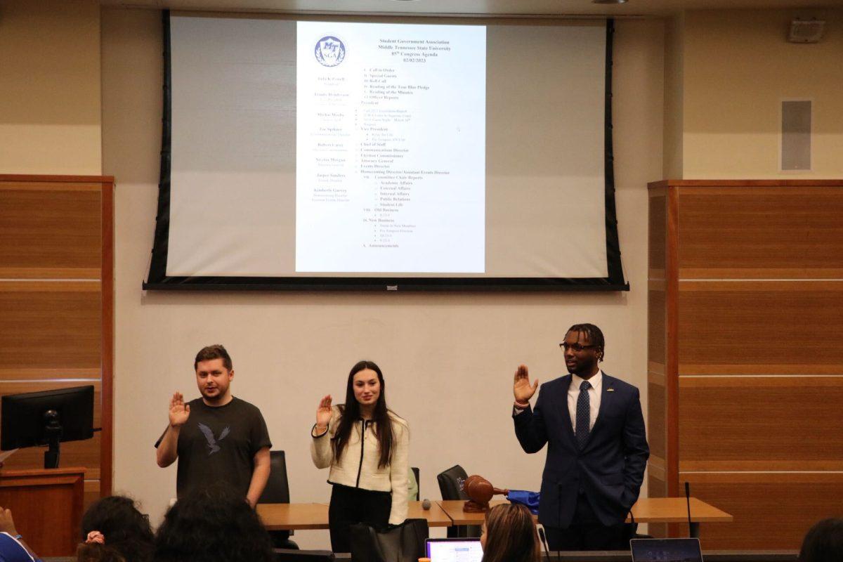 Senators Delquan Dorsey Jr., Lily Bethwoods and Logan J. Mcvey were sworn in at the SGA meeting on Thursday. (Photo by Gus Wright.)