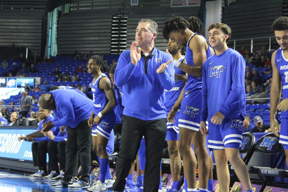 MTSU head coach Nick McDevitt claps on the bench. (Photo by Calvin White)