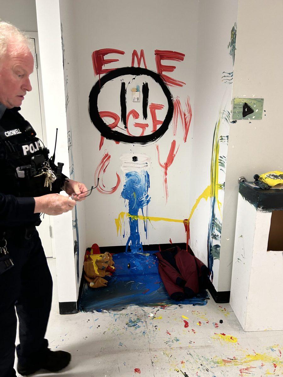 Master Police Officer Wayne Crowell responding to the vandalism of the niche gallery. (Photo courtesy of Megan Baker)