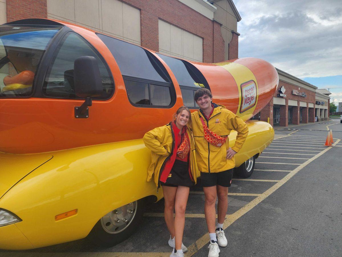 Jumbo Dog Jacob and Abbey Frankfurter standing with the Weinermobile at a Murfreesboro Kroger. (Photo by Jordan Reining).