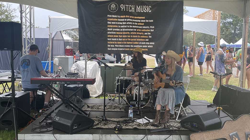 Singer-songwriter Katie Boeck (right) performs at the Café Stage, accompanied members of the Pitch Band.