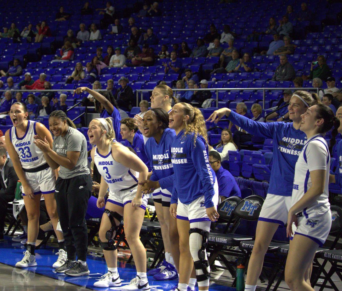 The MTSU women's basketball team celebrates on the bench. (Photo by Preston Todd)