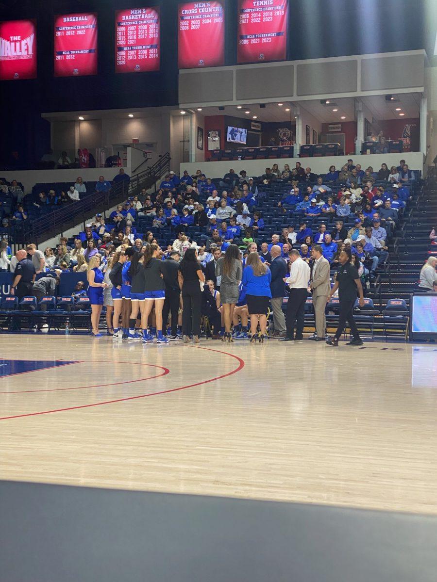 MTSU women's basketball gathers on the bench during a timeout. (Photo by Calvin White)