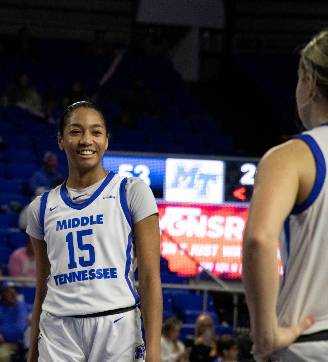 Ta'Mia Scott smiles during MTSU women's basketball's win over Liberty. (Photo by Preston Todd)