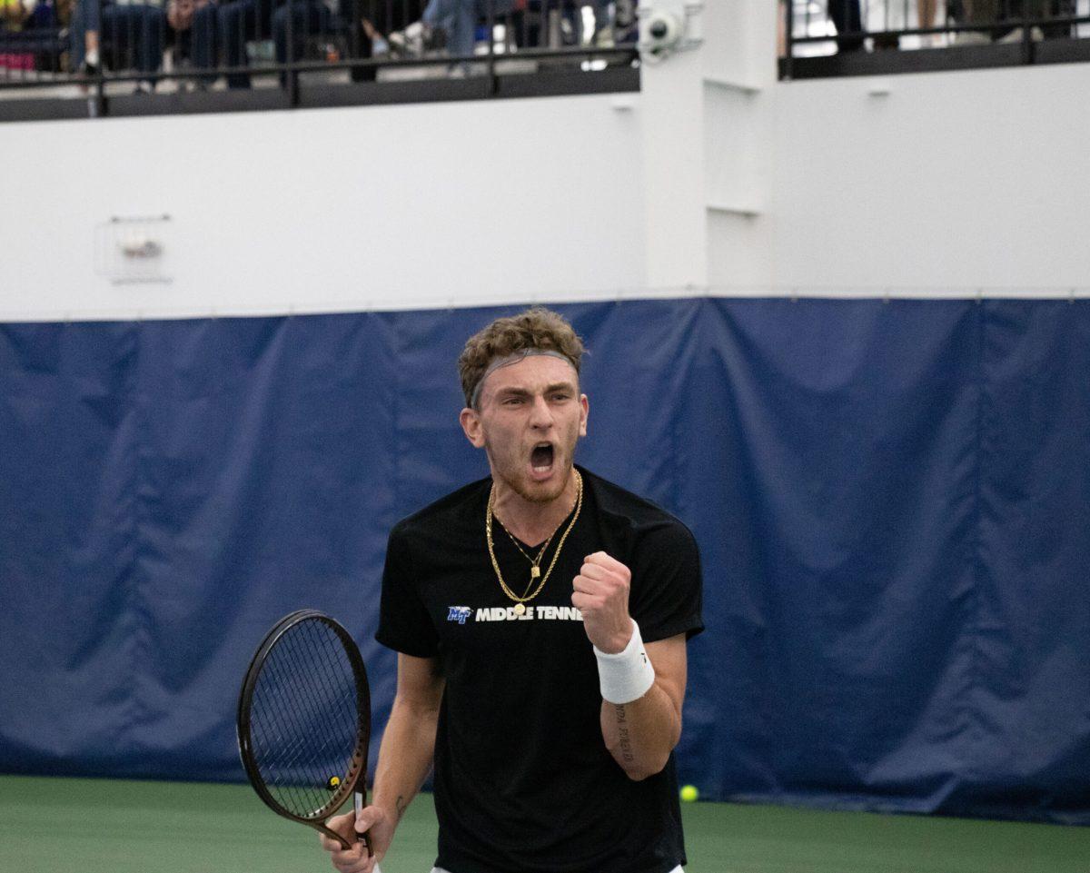 Karim Al-Amin celebrates in the MTSU men's tennis match against Virginia Tech. (Photo by Preston Todd)