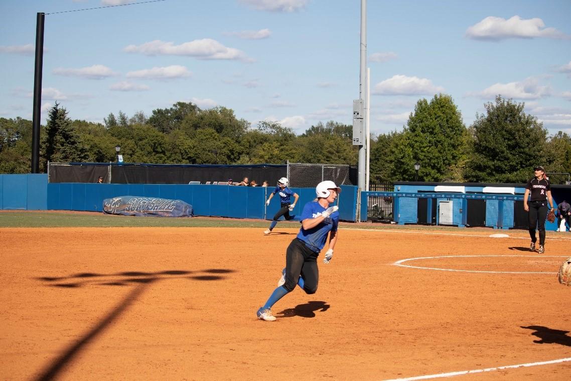 MTSU softball baserunners round the bases to score. (Photo by Preston Todd)