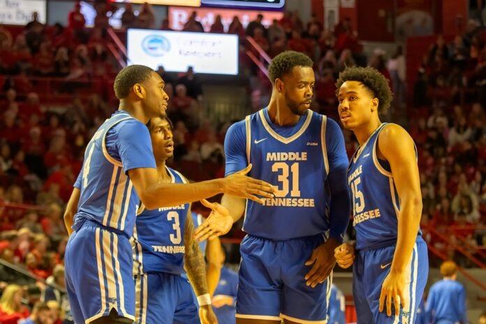 Justin Bufford, Jestin Porter, Jared Coleman-Jones and Jacob Johnson huddle together. (Photo by Khori Williams)