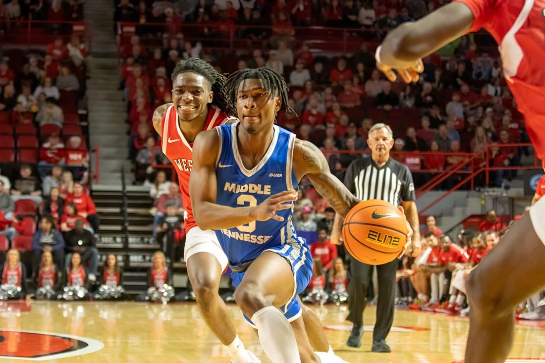 Jestin Porter dribbles through the lane against Western Kentucky. (Photo by Khori Williams)