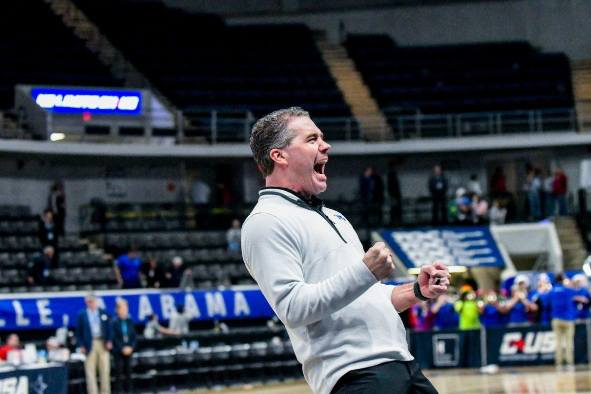 MTSU men's basketball head coach Nick McDevitt embraces a win over Louisiana Tech in the quarterfinals of the 2024 Conference USA Tournament. (Photo by Erin Douglas)