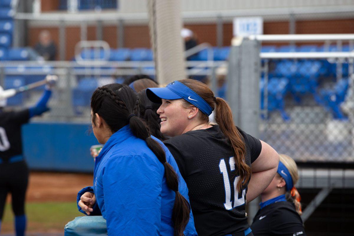 MTSU softball's Julia Garcia stands in the dugoout during a game against Detroit Mercy. 