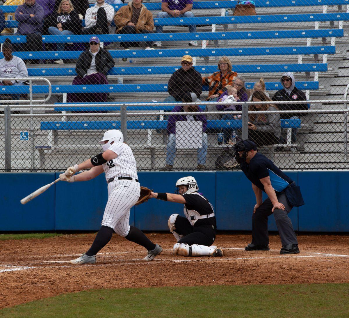 Julia Garcia swings the bat. (Photo by Preston Todd)