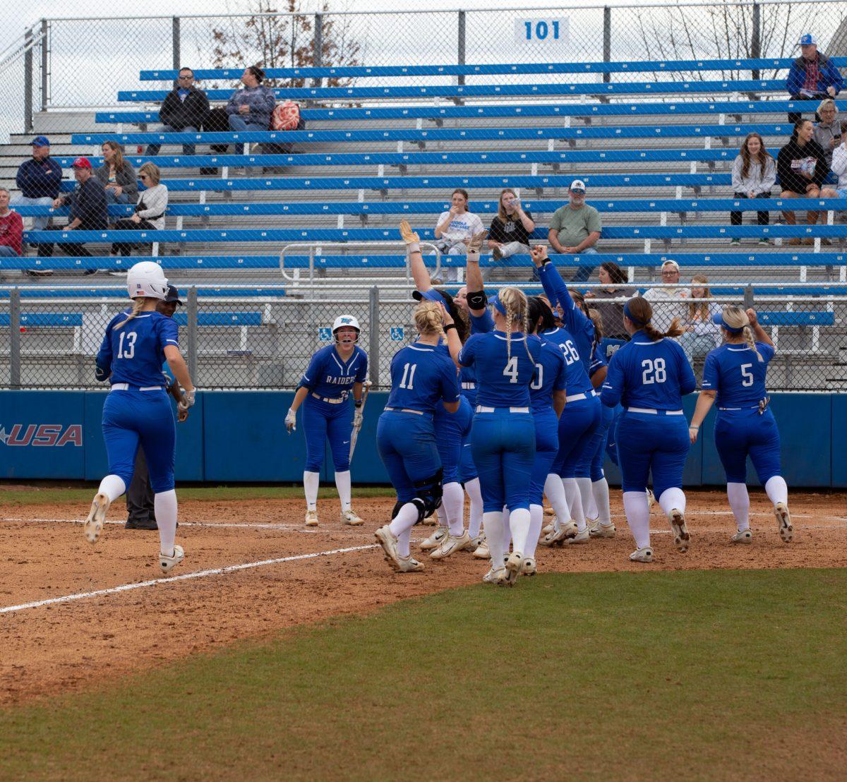 MTSU softball celebrates after an Ansley Blevins home run. (Photo by Preston Todd)