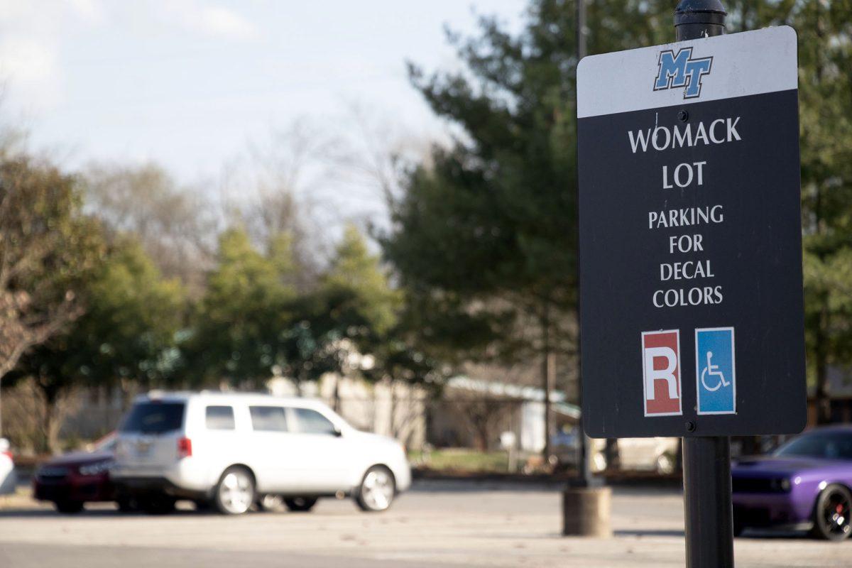 The Womack parking sign currently says that the lot is for red parking passes only. (Taken by Hannah Carley)