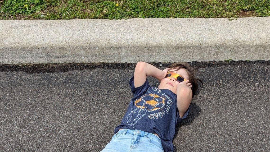 Ashley Martinez's son stares up in awe at the solar eclipse. (Taken by Ashley Martinez)