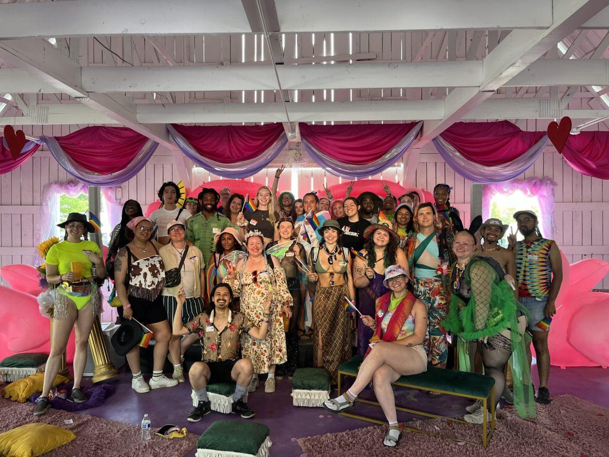 The participants of the QueerRoo Speed Dating & Friending gather for a group photo at the end of the event at Bonnaroo Music & Arts Festival in Manchester, Tennessee, on June 15, 2024. (Photo by Alyssa Williams)