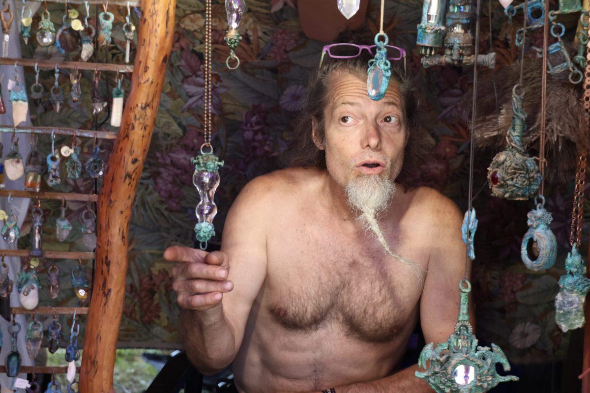 Patrick Ironwood discusses the process of making the electroformed copper at Bonnaroo Music & Arts Festival in Manchester, Tennessee, on June 14, 2024. (Taken by Skyler Wendell)