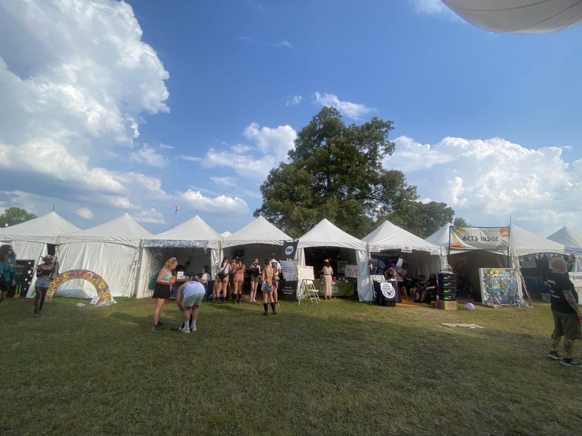 A row of tents in the Non-Profit Village at Bonnaroo Music & Arts Festival in Manchester, Tennessee, on June 16, 2024. (Taken by Skyler Wendell) 