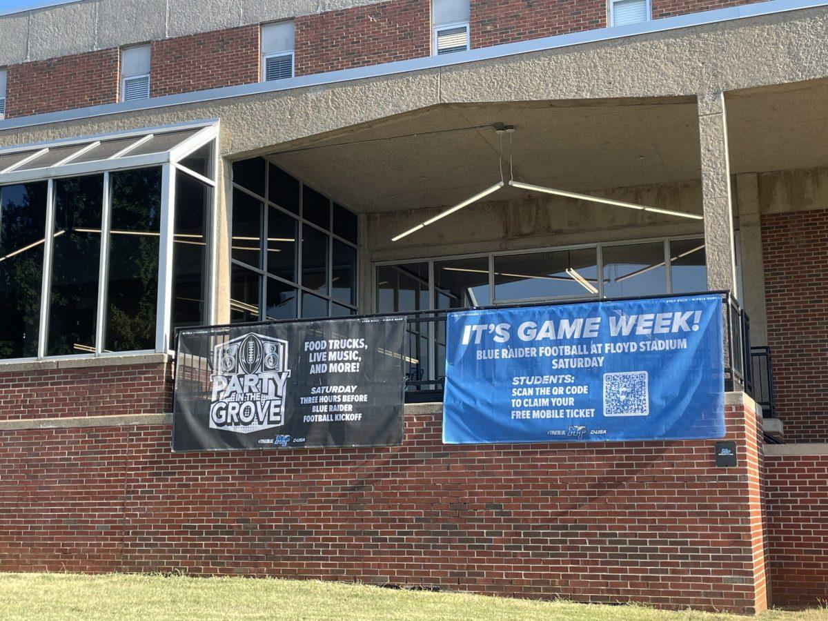 Banners advertising the inaugural Party in the Grove hang on the side of the KUC at MTSU in Murfreesboro, Tennessee, on Aug. 30, 2024. (Photo by Shauna Reynolds)