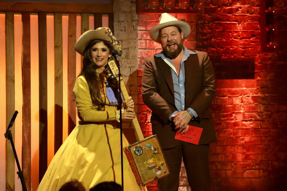 Nathaniel Rateliff presents the Artist of the Year award to Sierra Ferrell onstage for the 23rd Annual Americana Honors & Awards at Ryman Auditorium on September 18, 2024 in Nashville, Tennessee.  (Photo by Jason Kempin/Getty Images for Americana Music Association)