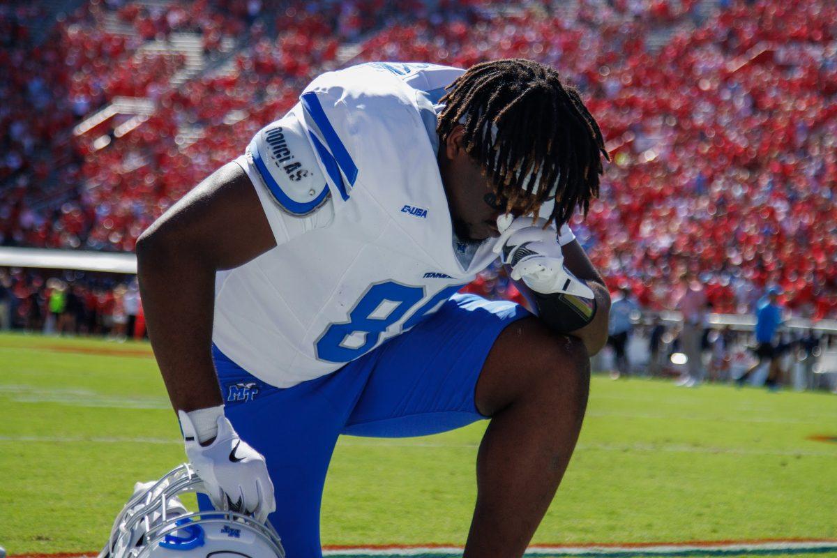 Brandon Buckner takes a moment to pray before kickoff, 9-7-2024. (Photo by Paige Mast).