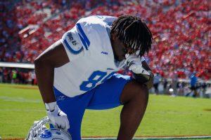 Brandon Buckner takes a moment to pray before kickoff, 9-7-2024. 