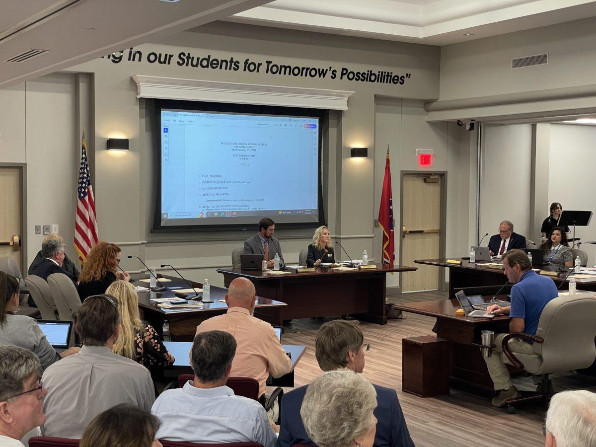 Rutherford County Director of Schools Dr. James Sullivan and school board chair Claire Maxwell prepare to begin a meeting in Murfreesboro, Tennessee, on Sept. 19, 2024. (Photo by Shauna Reynolds)