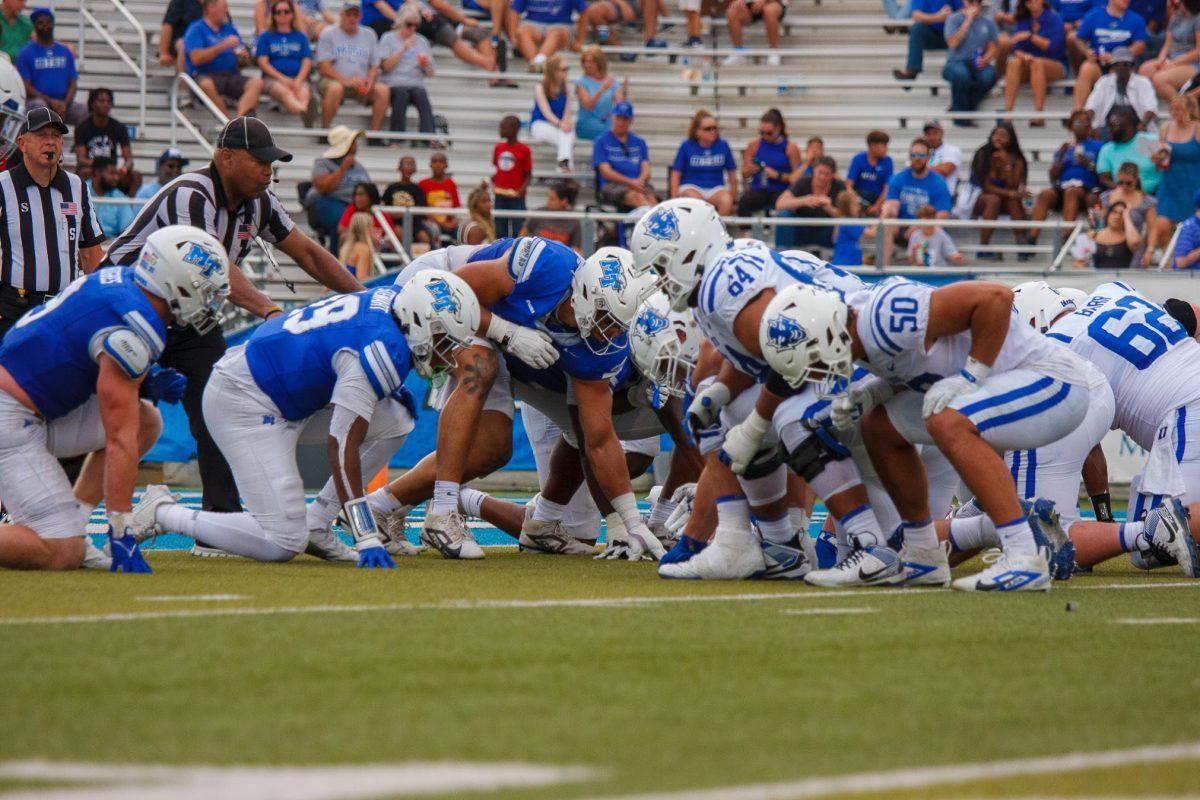 The trenches of MTSU and Duke clash on homecoming, 9-21-2004. (Photo by Paige Mast)